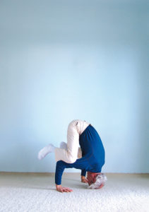 Yoga pose the crow- legs resting